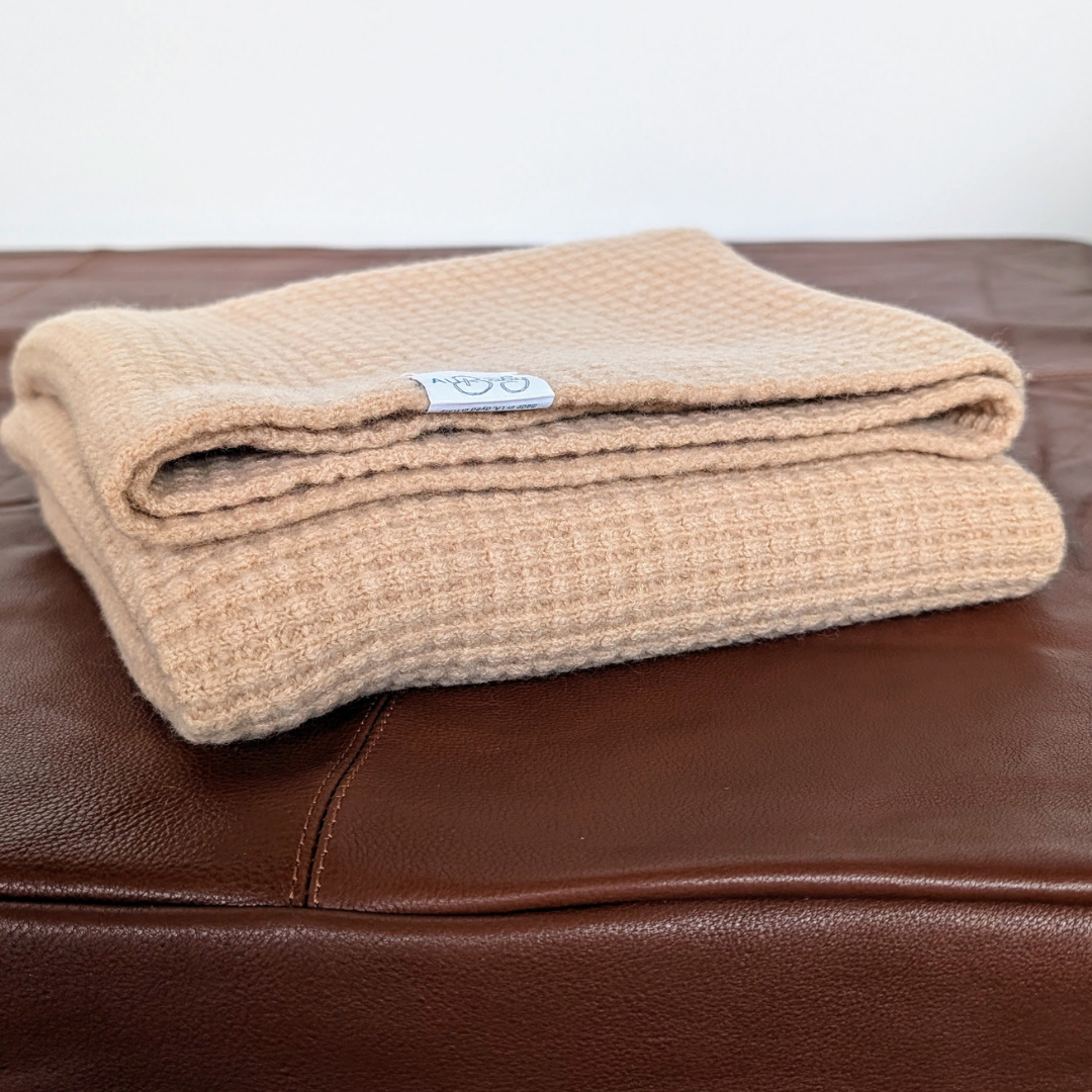 Image of folded AU Baby x Le Dog merino dog blanket