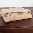 Image of folded AU Baby x Le Dog merino dog blanket