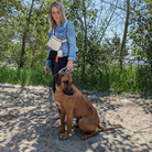 Woman and her dog in matching Le Walk Collection Bone set with Le Fanny a very stylish and functional dog walking crossbody bag.