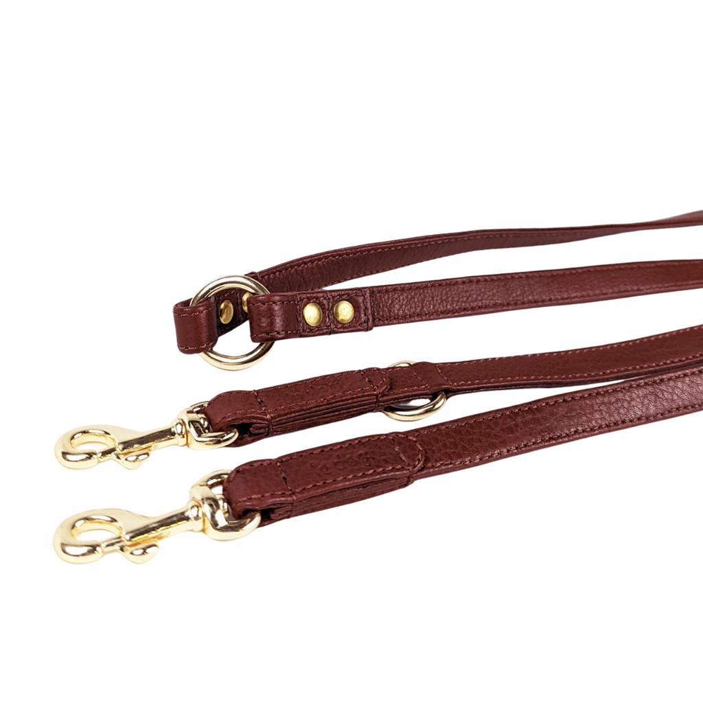 Black leather longline hands-free dog walking leash detail. All brass gold plated hardware.