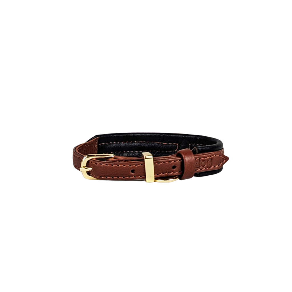 Stylish leather collar in cognac with black padding and all brass hardware for medium to large breeds